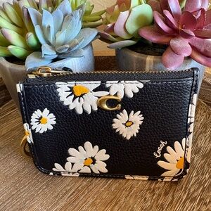 Coach Mini Skinny ID Case with a daisy floral print